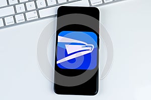 USPS MOBILE app logo on a smartphone screen.