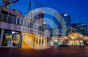 The USS Constellation Museum and Pratt Street Pavilion during twilight, at the Inner Harbor in Baltimore, Maryland