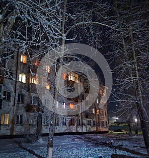 Ust& x27;-Kut Russia Siberia yard lights windows trees winter frozen frosty evening dreamtime walkwalk