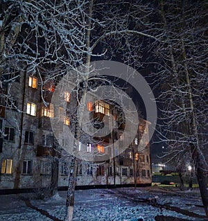 Ust& x27;-Kut Russia Siberia yard lights windows trees winter frozen frosty evening dreamtime walkwalk photo