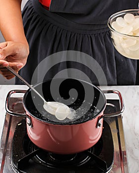 ut Sugar Palm Fruit Kolang Kaling or Cangkaleng on a Boiling Water in a Pan at Indonesian Kitchen. Proces Making Manisan Kolang
