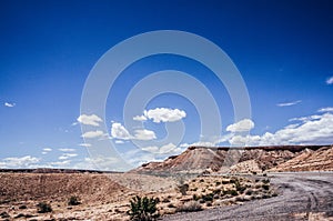 Utah desert, blue sky, red cliff from high way