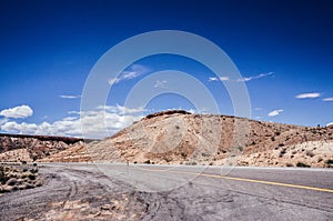 Utah desert, blue sky, red cliff from high way