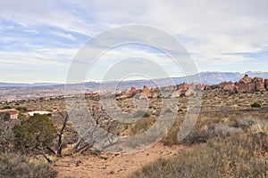 Utah Desert Land in Arches National Park with Whispy Clouds