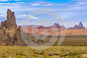 Utah Monument Valley rock landforms jut in sharp relief out of the surrounding land