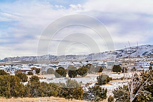 Utah valley residential landscape with houses and mountain on a snowy winter