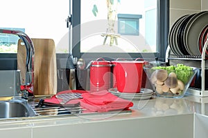 Utensils on counter in modern kitchen room
