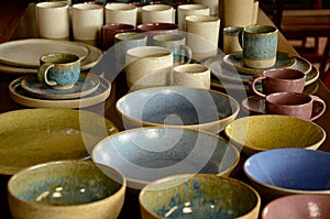 Utensils and objects for home, kitchen, Handmade ceramic cups, mugs, plates, saucers, bowls and glasses, painted in various colors
