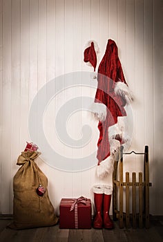 Utensils of santa clause - jacket, hat, boots, sack and sledge.