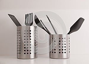Utensils in stainless steel container