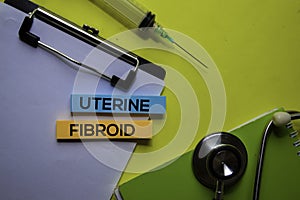 Uterine Fibroid on top view yellow table. Healthcare/medical concept photo