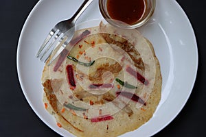 Uthappam, dosa from South India, thicker, Pancakes with toppings of mushrooms, beetroot, chilli and carrots