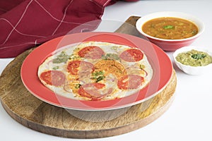 Uthappam or uttapam is a type of dosa