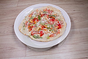 Uthappam or Uttapam is a type of dosa from southern India that is thicker, with tomato, onion, chilli packets,cashew nut and