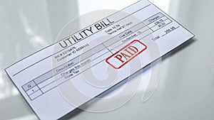 Utility bill paid, seal stamped on document, payment for services, charges