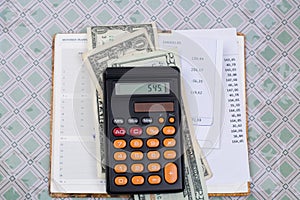 Utility or mortgage bills, calculator and US dollars - finance c