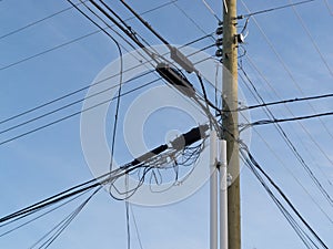 Utility pole confusing power cable phone line mess