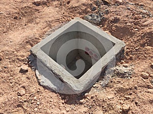 Utility services manhole under construction at the construction site.