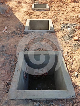 Utility services manhole under construction at the construction site.