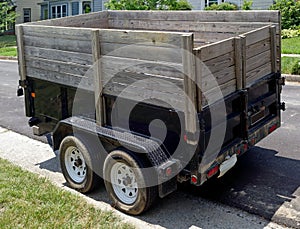 Utility trailer with wooden extension photo