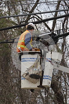 Utility Worker Repairing Lines