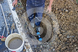 Utility worker in trench repair the broken pipe 3