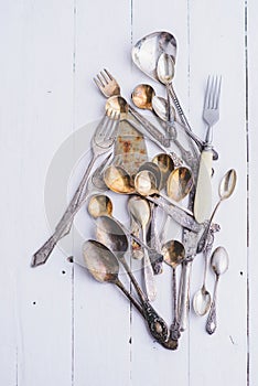 Ð¡utlery - spoons, forks and knives in vintage style on the table