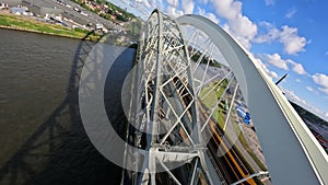 Utrecht, 27th of June 2022, The Netherlands. NS train Nederlandse Spoorwegen FPV drone high speed follow along a bridge