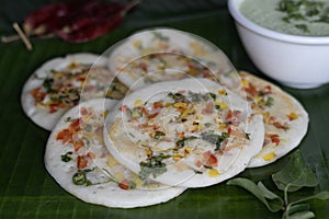 Uttapam on plantain leaf. Healthy pan cake made of fermented batter of rice and lentils