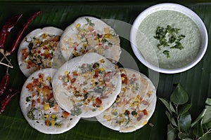 Uttapam on plantain leaf. Healthy pan cake made of fermented batter of rice and lentils