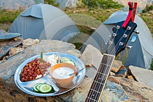 Uttarakhand camping vibes: Rajma-chawal feast with curd and salad, set against tents and guitar strums