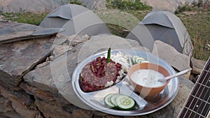 Uttarakhand camping vibes: Rajma-chawal feast with curd and salad, set against tents and guitar strums
