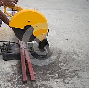 Utting steel rod by machine on a day at the