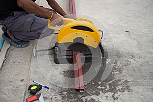 Utting steel rod by machine on a day at the