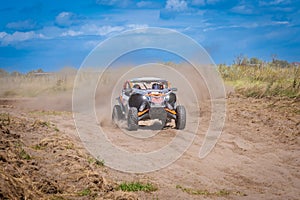 UTV in action offroad vehicle racing on sand dune. Extreme, adrenalin. 4x4