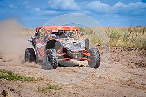 UTV buggy offroad vehicle racing on sand. Extreme, adrenalin. 4x4