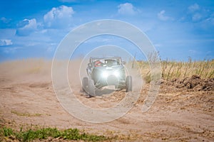 UTV buggy offroad vehicle racing on sand. Extreme, adrenalin. 4x4