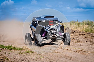 UTV buggy offroad vehicle racing on sand. Extreme, adrenalin. 4x4