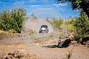 UTV vehicle offroad kicking up sand on dune. Extreme, adrenalin. 4x4