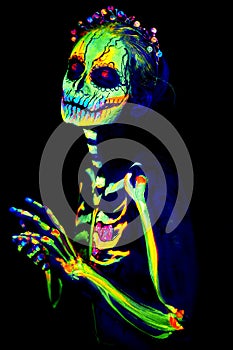 UV body art painting of helloween female skeleton