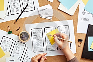 UX designer working on mobile app wireframes