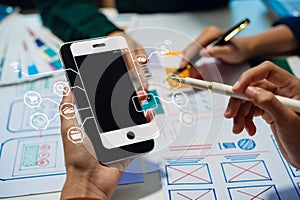 UX developer and ui designer brainstorming about mobile app interface wireframe design with customer breif and color code, User