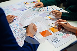 UX developer and ui designer brainstorming about mobile app interface wireframe design with customer breif and color code, User