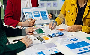 UX developer and ui designer brainstorming about mobile app interface wireframe design with customer breif and color code, User