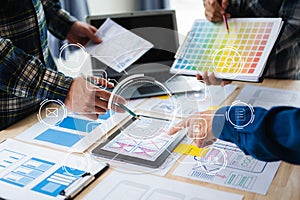 UX developer and ui designer brainstorming about mobile app interface wireframe design with customer breif and color code at