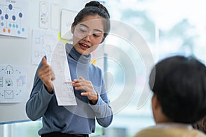 Ux developer and ui designer use augmented reality brainstorming about mobile app interface wireframe design on desk at