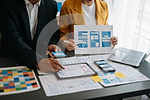 UX graphic designer planning application process development prototype wireframe for web smart phone. Creative digital development