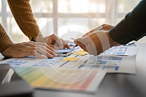 UX, UI developer and ui designer brainstorming about mobile app interface wireframe design with customer breif and color code at