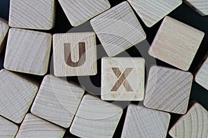 UX, User Experience design concept, cube wooden block combine word UX, development of a journey and interaction between product o