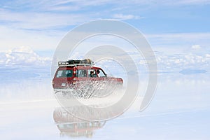 Uyuni Bolivia Driving on wet saltflats photo